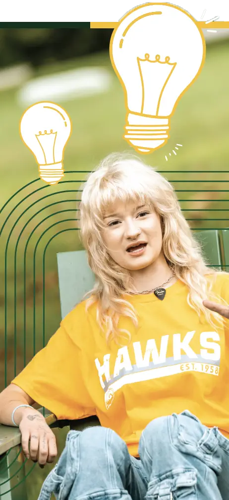 A young woman in a yellow "HAWKS" t-shirt sits comfortably outdoors, with light bulb illustrations surrounding her, representing ideas or inspiration.