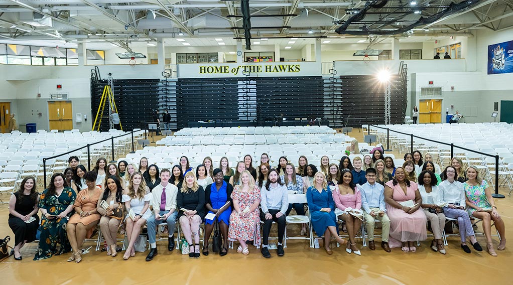 Nursing graduates pose together