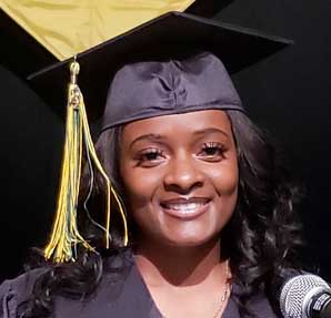 young african american female in graduation cap and gown