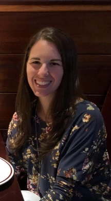 CSM student Micolina Croson, smiling, in a restaurant