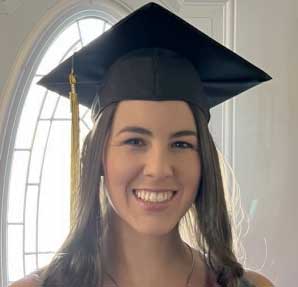 CSM student Micolina Croson, smiling in a restaurant