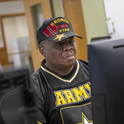 CSM student Phillip Ball working in front of a computer screen