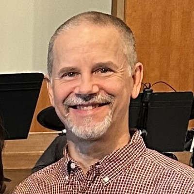 headshot of smiling man