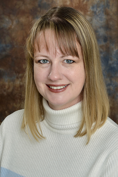 A professional portrait of CSM professor Melanie Osterhouse