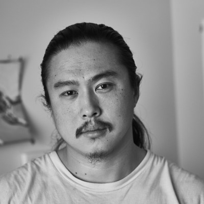 Black and white photo of CSM art instructor Coy Gu