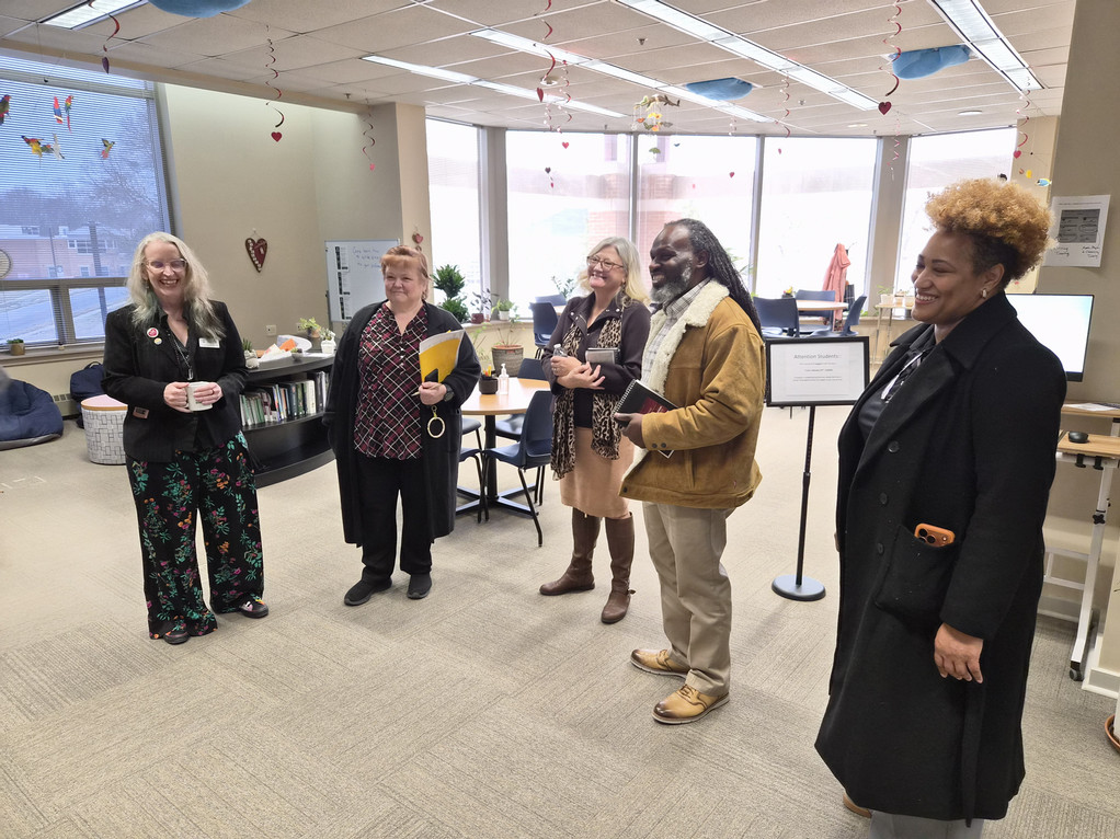 ACBSP reaccreditation team and CSM representatives stand in the Math Resource Center and Writing Center