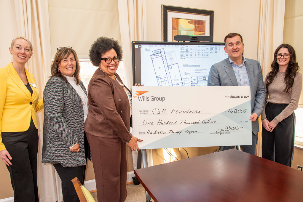 Wills Group present check to CSM President and CSM Foundation