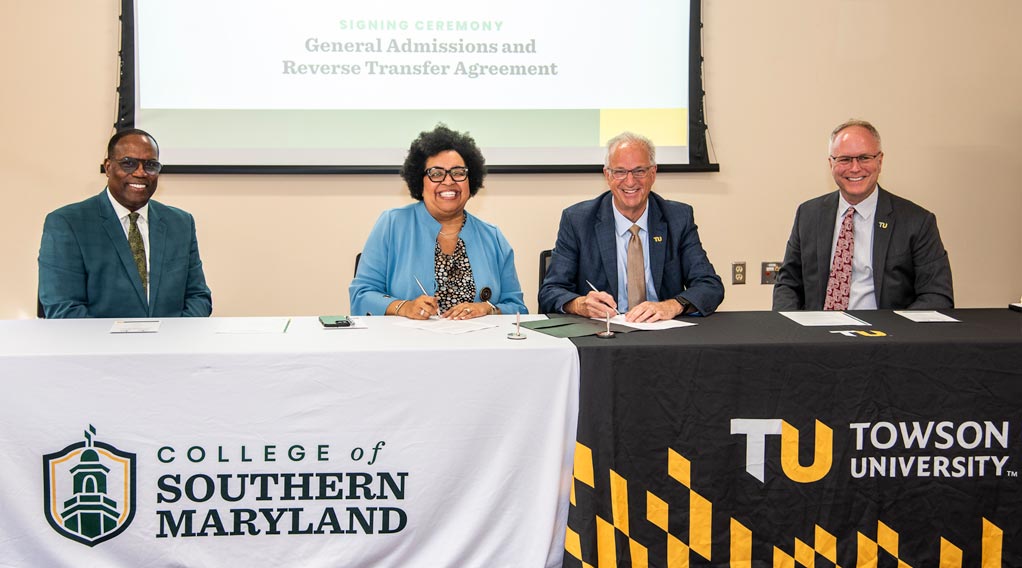 Signing ceremony for the General Admissions and Reverse Transfer Agreement between the College of Southern Maryland and Towson University, featuring four officials.