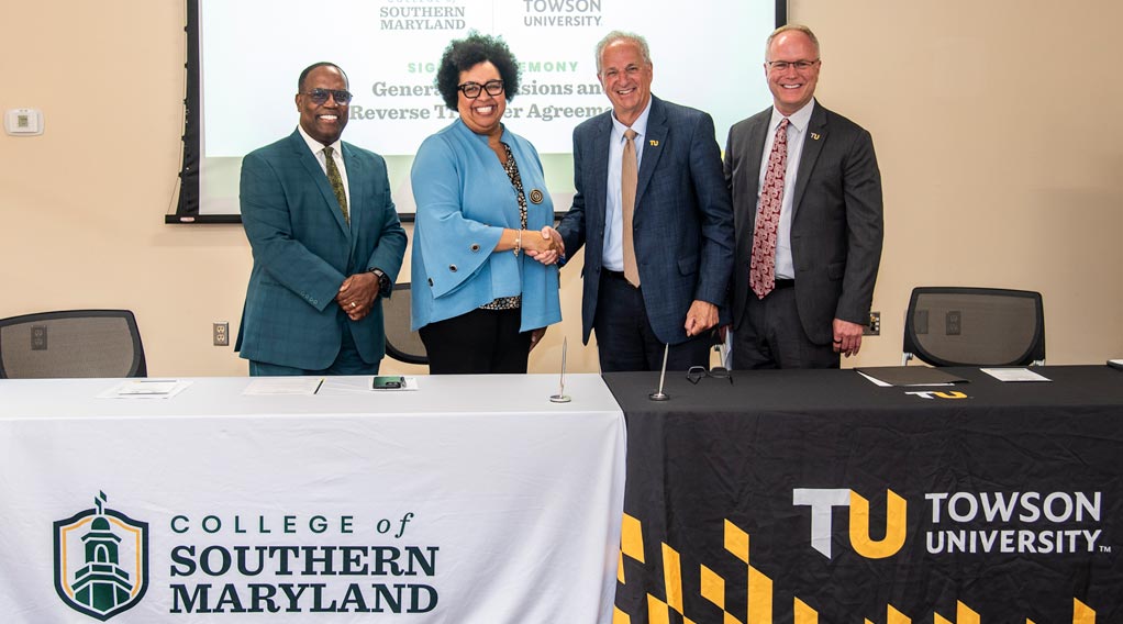Event photo of representatives from the College of Southern Maryland and Towson University during a signing ceremony for a new agreement.