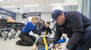 man kneeling to show demonstration of helping person on the floor