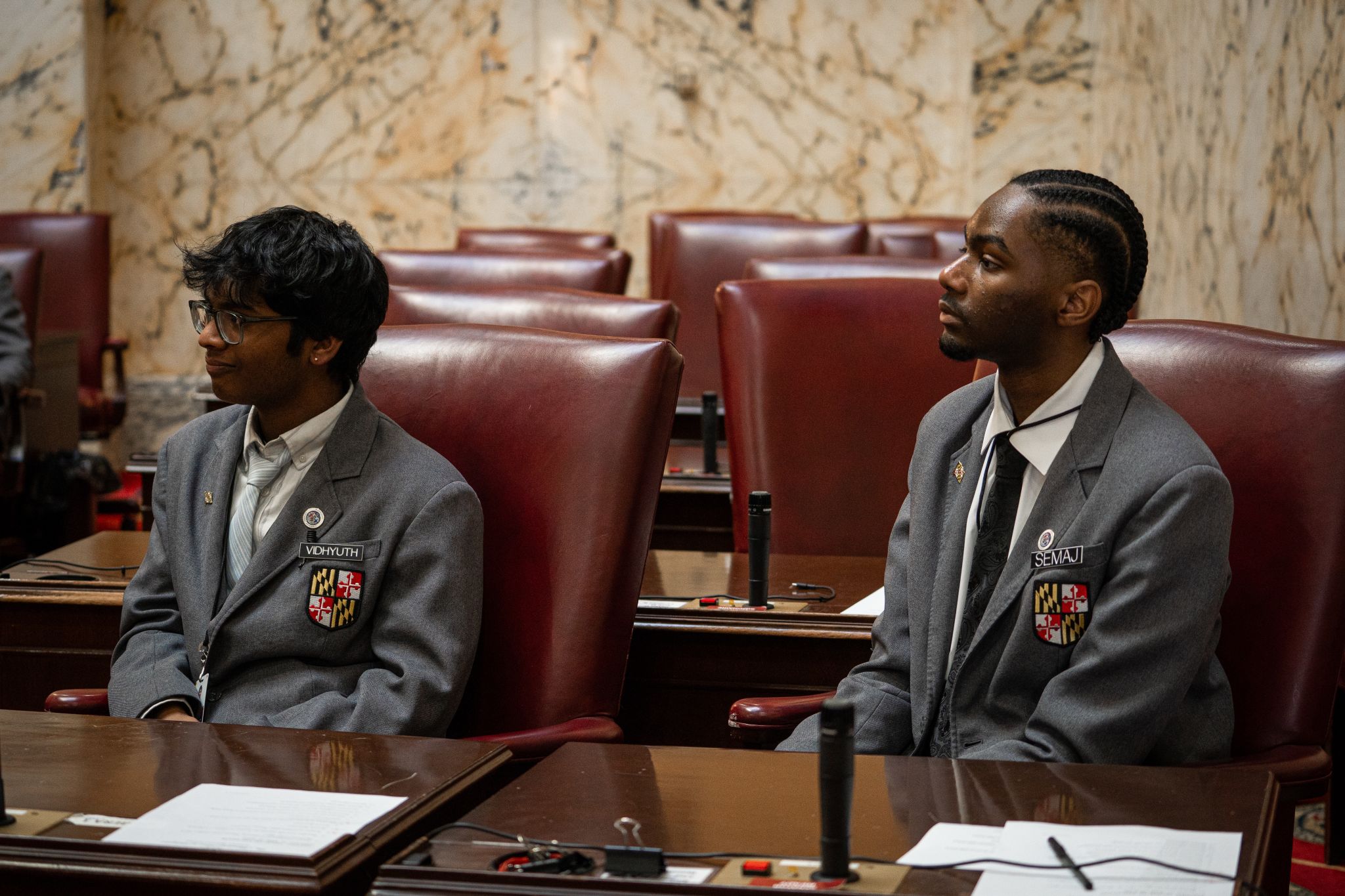 Semaj Thomas at the Maryland State House listening to a speaker out of frame