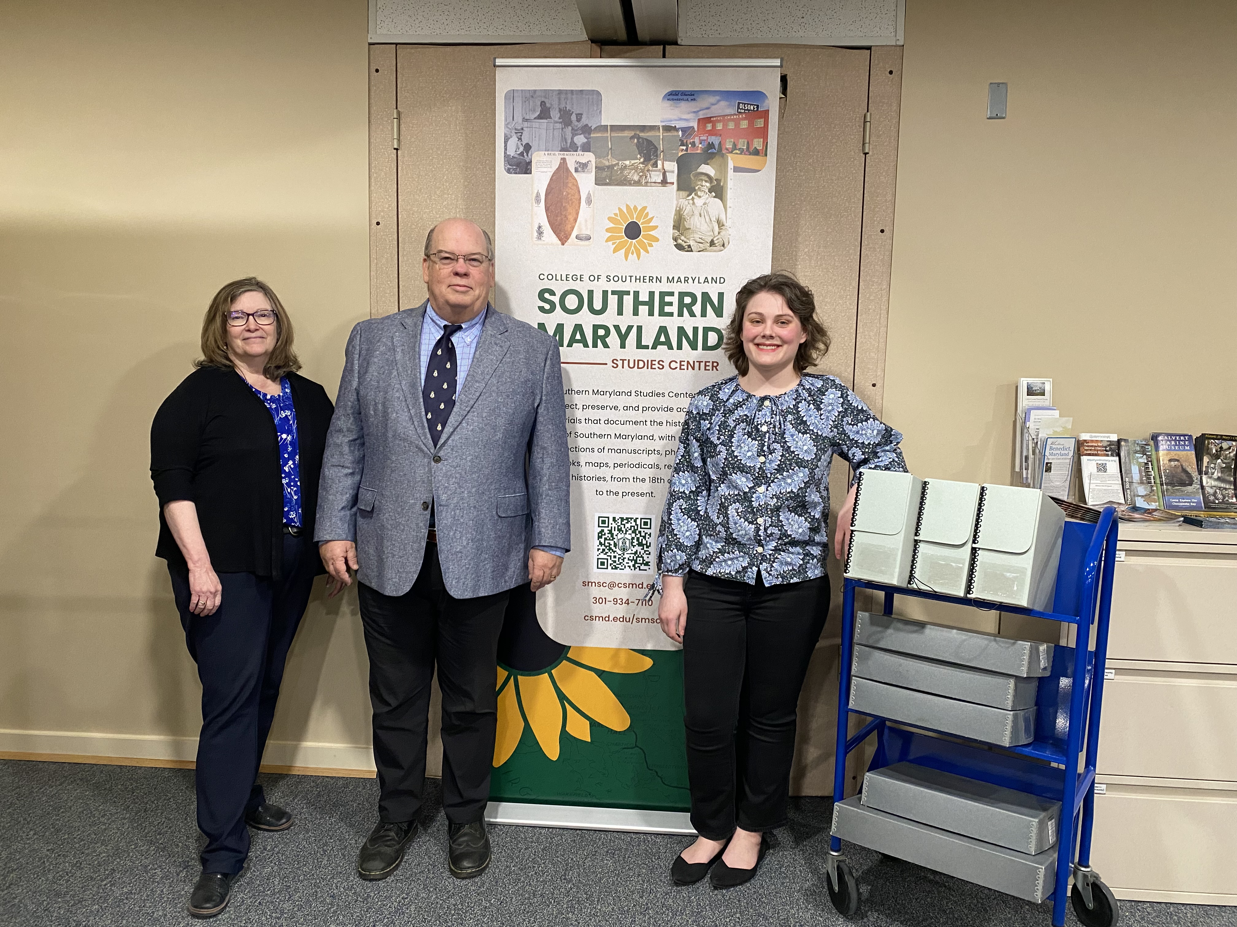 Representatives from the National Society of Descendants of Lords of the Maryland Manors and SMSC stand with archives
