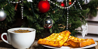 Holiday Breakfast showing a fancy coffee and french toast sitting in front of a Christmas tree