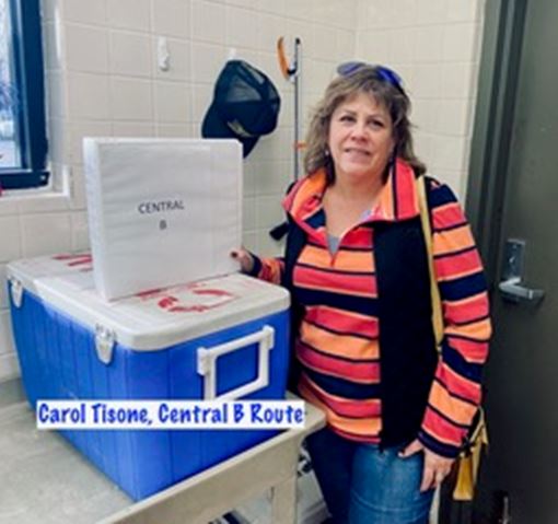 Woman poses with a binder that read Central B Route