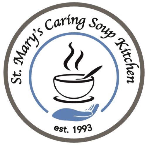 Logo of St. Mary's Caring Soup Kitchen featuring a bowl of soup with steam rising above it, accompanied by a hand graphic. Established in 1993.